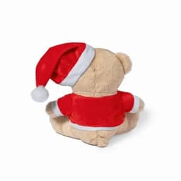 A teddy bear wearing a red Christmas outfit and a Santa hat, viewed from the back.