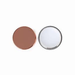 A makeup compact featuring a bronze lid and a mirror on the other side, with a metallic finish.