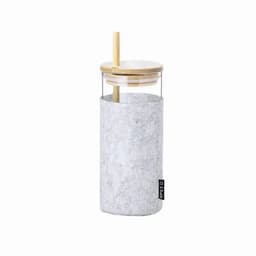 A drink bottle with a clear glass body, grey sleeve, bamboo lid, and a straw. It features a logo on the side.