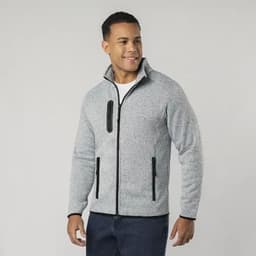 A polar fleece jacket in grey with black zip and pocket detailing, worn by a smiling model.