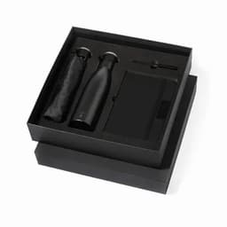 A drink bottle, a notebook, and a pen presented in a black gift box with a black umbrella.