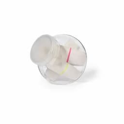 A drink bottle with a transparent design, featuring white contents secured with coloured bands inside.