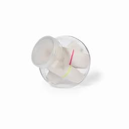 A clear jar containing white objects secured with pink and yellow bands, with a round lid.