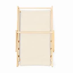 A folding chair with a beige fabric seat and a light wooden frame. The chair is in a closed position.