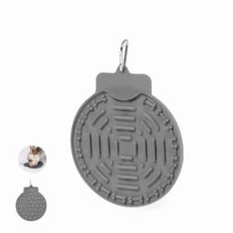 A grey silicone pet feeding mat with a textured design, featuring a clip for attachment.