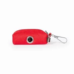 A red zippered pouch with a metal clip and a circular opening on the front, featuring a logo.