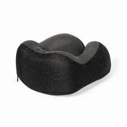 A travel pillow in black with a contoured shape and textured fabric, designed for comfort and support.
