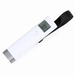 A digital thermometer with a white body and a black strap. It features a clear display screen.
