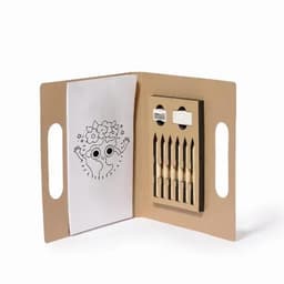 A craft kit featuring a colouring book, coloured pencils, and a sharpener in a foldable cardboard case.