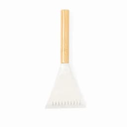 A garden rake with a bamboo handle and a white triangular head for soil cultivation.