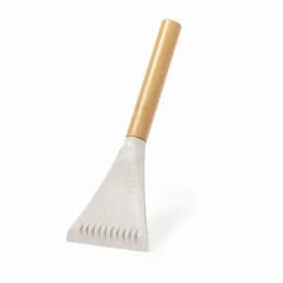 A concrete scraper with a triangular blade and a wooden handle. The blade is light grey, and the handle is natural wood.