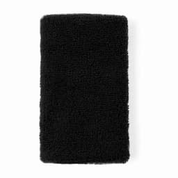 A soft black towel with a textured surface, featuring a simple rectangular shape. It has no visible logos or branding.