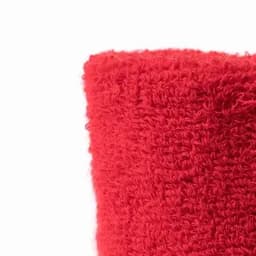 A drink bottle in a bright red, textured fabric cover. Features a logo on the side.