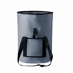 A grey cylindrical bag with black straps and a front pocket, featuring a closure mechanism at the top.