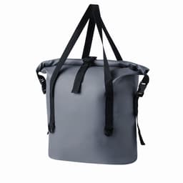 A grey waterproof bag with black straps, featuring a roll-top closure and adjustable shoulder straps.