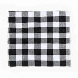 A checkered cloth featuring black and white squares arranged in a grid pattern.