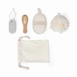 A bath set featuring a loofah, brush, pumice stone, exfoliating mitt, and cotton bag, all in neutral colours.