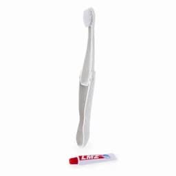 A toothbrush with a silver handle and a red tube of toothpaste beside it, featuring a logo.