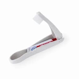 A compact travel toothbrush holder in a speckled white finish, including a small toothpaste tube and a toothbrush.