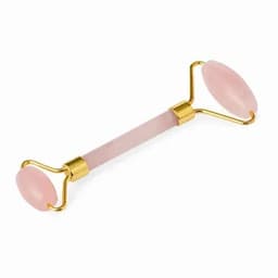 A rose quartz facial roller with gold accents, featuring two smooth oval ends for skincare applications.