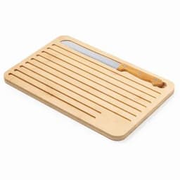 A wooden cutting board with grooves and a stainless steel knife featuring a wooden handle.