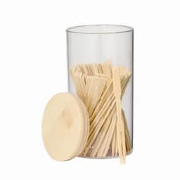 A clear container filled with wooden skewers, topped with a wooden lid. The skewers are arranged neatly inside.