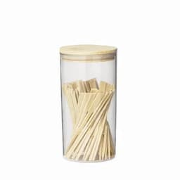 A clear jar containing wooden sticks with a wooden lid. The sticks are arranged inside the jar.