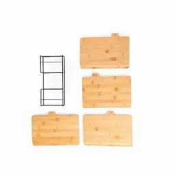 A set of four bamboo cutting boards in different sizes with a black metal storage rack.