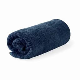 A rolled navy blue towel with a soft, plush texture.