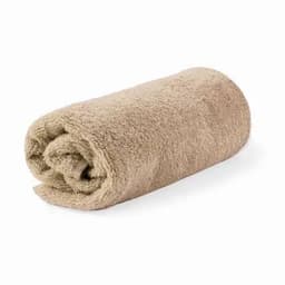 A rolled towel in a soft beige colour, showcasing a plush, textured fabric.