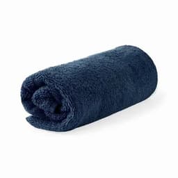 A rolled navy blue towel with a soft, textured appearance. It has a simple design and is fluffy.