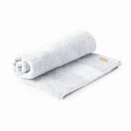 A grey, rolled towel with a textured surface and a small logo on the side.