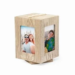 A photo cube display in light wood featuring four frames for displaying pictures. It has a modern design and a logo.