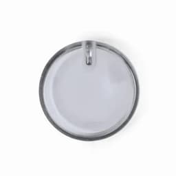 A drink bottle cap in metallic silver, featuring a round, smooth design with a small opening.