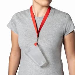 A drink bottle with a transparent body hanging from a red lanyard, worn around a person’s neck.