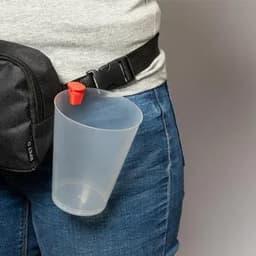 A drink bottle holder attached to a belt, with a transparent cup featuring a red lid.