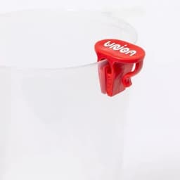 A clear drink bottle with a red clip attachment, featuring a logo on the clip.