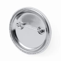 A round metal pin badge with a shiny silver finish and a safety pin clasp on the back.