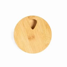A wooden round serving board with a small cutout, featuring a natural bamboo finish.