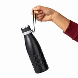 A drink bottle in matte black with a diamond-shaped pattern, held by a hand with a strap attached.