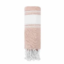 A rolled towel in a soft pink hue, featuring a textured design and white tassels at one end.