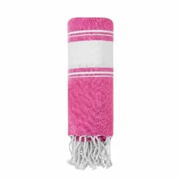 A pink towel rolled up with white stripes and tassels at the ends. It features a smooth texture.