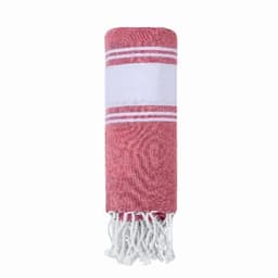 A towel in red with white stripes and tassels, rolled up and neatly presented. It features a branding logo.