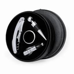 A wine accessory set in a round black case, featuring a corkscrew, stopper, pourer, and ring, all with a silver finish.
