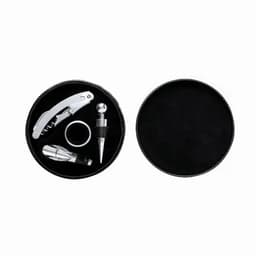 A black circular box containing a corkscrew, wine stopper, and a ring in silver finish.