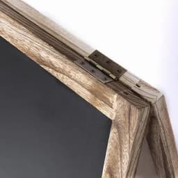 A wooden frame with a hinged corner, displaying a black surface. The wood has a natural finish.