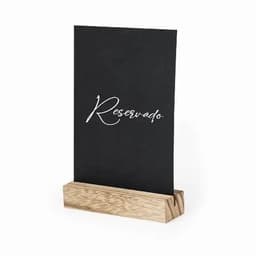 A table sign holder with a black card displaying the word "Reservado" and a wooden base.