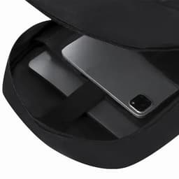 A black backpack featuring a spacious interior with a laptop compartment and a slot for a phone. It has a logo.