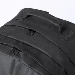 A black backpack featuring multiple zipped compartments and sturdy handles. It has a sleek, modern design.