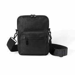 A black crossbody bag with a zippered main compartment and an adjustable strap, featuring an additional front pocket.
